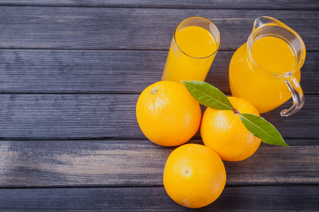 orange juice in the jug on the table close upの写真素材