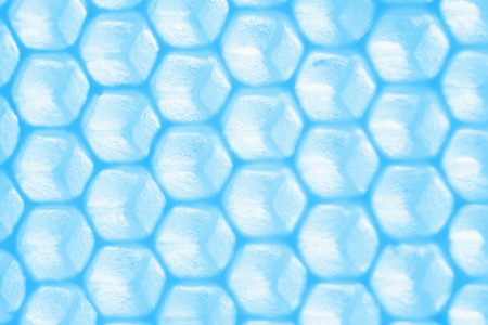 abstract closeup honeycomb pattern in blue tonesの写真素材
