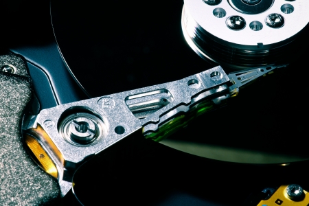 Close up of hard disk with black reflection