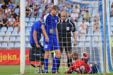 RIJEKA, CROATIA - JULY 27, 2012: unknow soccer players at match between NK Rijeka (white) vs. NK Zadar (blue) on July 27 2012 in Rijeka, Croatiaのeditorial素材