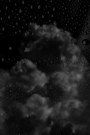 Rain drops over dark skyeの写真素材