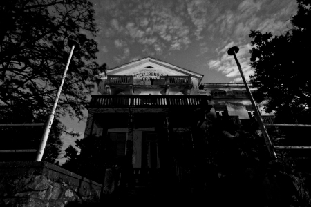 Abandoned spooky hotel at nightの写真素材