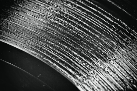 Scratched vinyl record with the add of scratches effect and film noise for achieving retro styleの写真素材