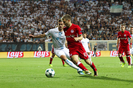 RIJEKA, CROATIA - August 22, 2017:  Ivan Martic of Rijeka and Marko Marin of Olympiacos during the UEFA Champions League play-off match between HNK Rijeka and Olympiacos FC at HNK Rijeka Stadiumのeditorial素材