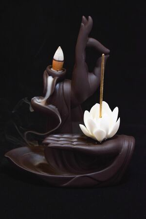 Zen figure with return cone bringing peaceの写真素材
