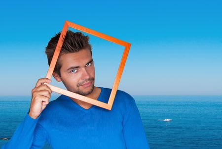 Portrait of young handsome sexy man on background Seaの写真素材