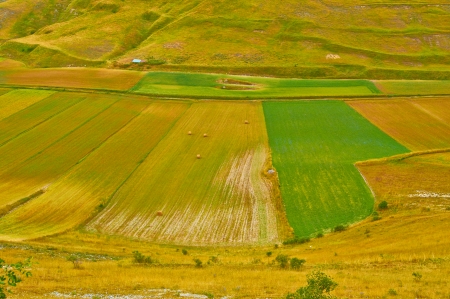Wonderful spring panorama of fields and mountains of Italyの写真素材