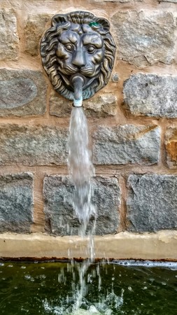 details of architecture, historical buildings of Italy. Stone walls and stone mask.の写真素材