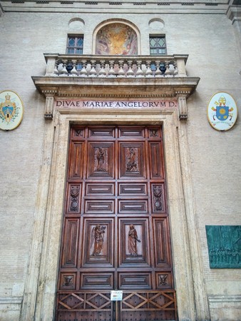 Details of architecture, historical buildings of Italy. Stone walls and stone mask. Ascoli Piceno. Marche.の写真素材