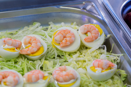 Sushi sea food in the restaurant close up. King prawns, seaweed and caviar for gourmets. Japanese and Chinese cuisine.の写真素材