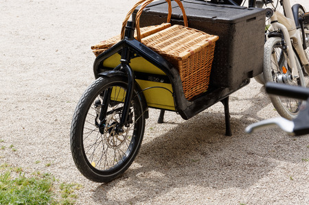 Vintage bike for a picnic and shopping stands near the brick wall of the Italian city.の写真素材