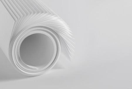 Rolled up sheets of plain white paperの写真素材