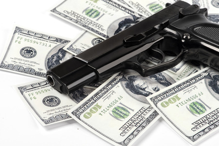 Gun pistol and money dollars background