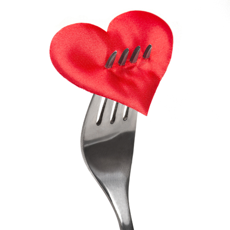 Fork with red heart on white backgroundの写真素材