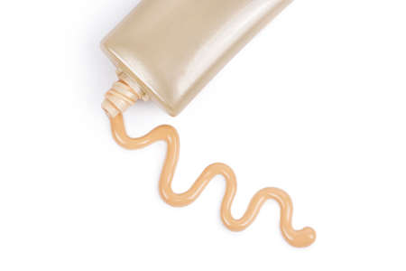 Liquid foundation and cosmetic tube on whiteの写真素材