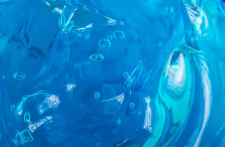 Blue liquid gel. Transparent skin care product