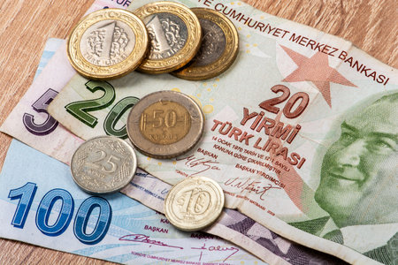 Turkish Lira banknotes and coins on wooden tableの写真素材