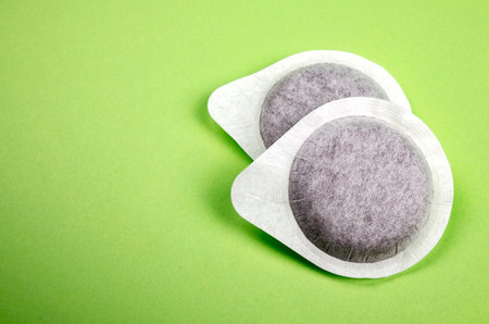 Coffee pods on green backgroundの写真素材