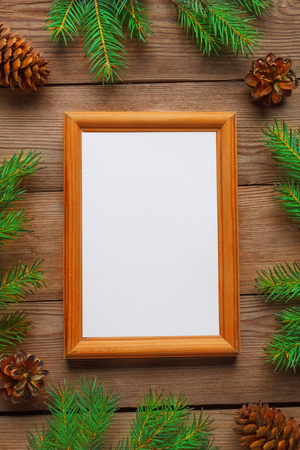 Christmas natural background with frame for photography, with fir branches and cones.の写真素材