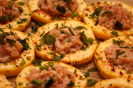 Sliced fresh slices of zucchini, filled with minced meat, on food paper. Food Backgroundの写真素材