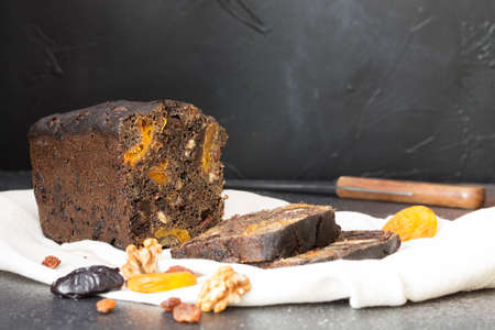 Homemade sweet dessert black bread, with malt, prunes, walnuts,flour-based sourdough, without...