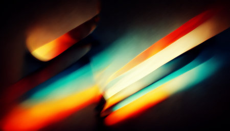 Defocused glow. light flare. Ray motion. Blur red orange blue color flecks glare on dark black collage abstract background.の素材