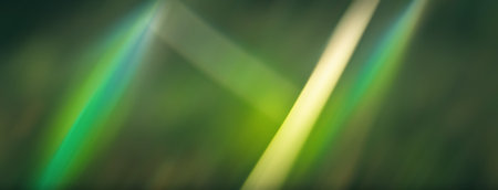 Light flare overlay. Blur rays. Glaremotion. Defocused green yellow color beam glow radiance on dark art illustration abstract background.の素材