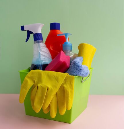 A colorful set for cleaning various surfaces in the kitchen, bathroom and other rooms. The concept of cleaning. Early spring regular cleaningの写真素材