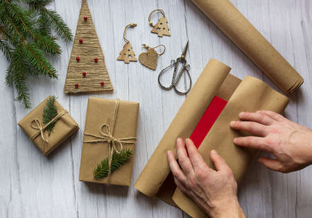 Man packing presents for new year and christmas.の写真素材