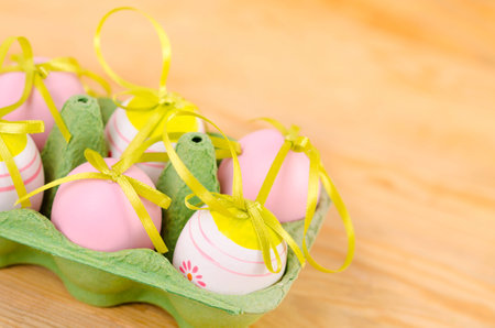 Easter decorative egg and bouquet of flower on the wooden background