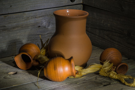 still life with set of pottery on an old wooden tableの写真素材