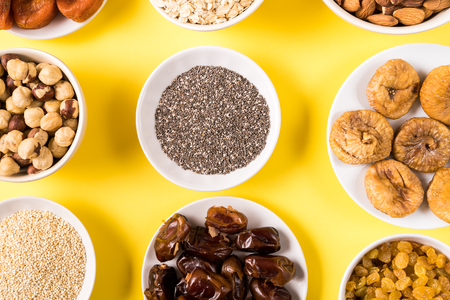 Top view the set of Superfoods in Bowls on yellow Background.の写真素材