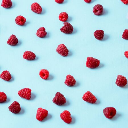 Red fresh ripe raspberry pattern. Summer concept. Creative concept. Flat lay.の写真素材