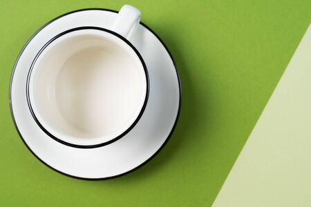 Flat lay food background with empty white cup, over green background, copy space.の写真素材