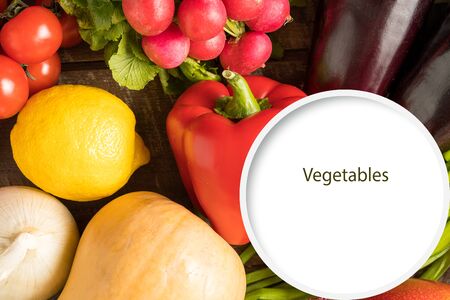 Food concept. Flat lay of different vegetables over wooden background and copy space, square image.の写真素材