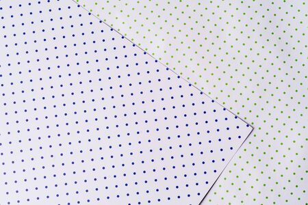 Multi colored abstract paper of pastel colors, with geometric shape, flat lay.