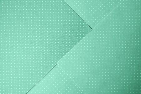 Flat lay abstract paper toned in green mint color, with geometric shape, flat lay.