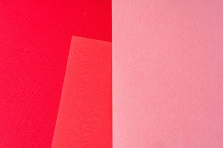 Flat lay Minimal creative paper background toned in Pink and red colors, with geometric shape.の写真素材