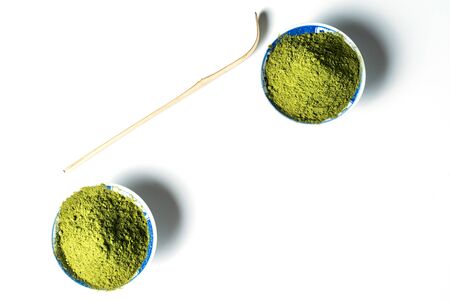 Matcha green tea powder in bowls isolated on white background.の写真素材