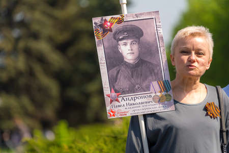 Zhukovsky,RUSSIA,MAY 9,2019: Immortal regiment on Victory Day the 9th of May, when people go column and carry banners with portraits of their relatives who participated in the great Patriotic war.のeditorial素材