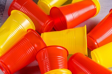 Colored plastic cups. The concept of plastic recycling and the environment. Plastic waste. Top view.の写真素材