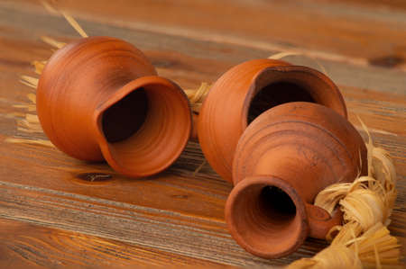 Still life with clay jugs on a wooden table.の写真素材