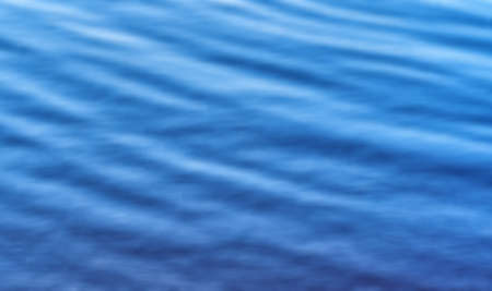 Blurry bright blue unfocused nature abstract background.
