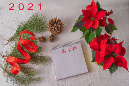 Festive Christmas and new year background with a blank Notepad sheet for writing down wishes and...