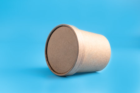 Paper brown coffee cup on blue background.の写真素材