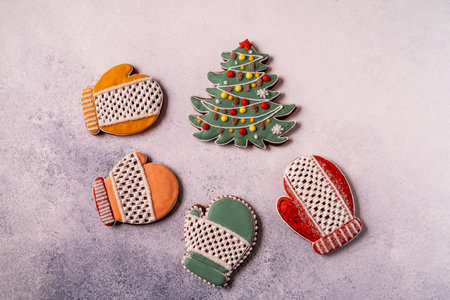 Christmas Gingerbread on gray concrete background. Snowflake, spruce, star, sleigh, cones, cone star...
