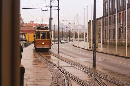 Porto, Portugal- November 22,2014: Vintage tram in Porto district.のeditorial素材