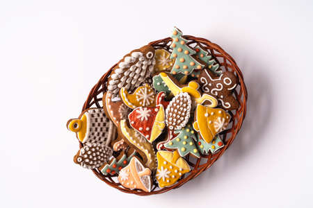 Festive Christmas and new year decorations with gift boxes and gingerbreads on blue background.