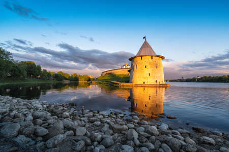 Pskov Kremlin, Russia, at sunset, illuminated by the rays of the sun, at the confluence of two rivers, the Great and Pskov.のeditorial素材