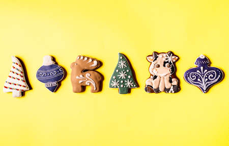 Christmas Gingerbread isolated on yellow background. Flat layの写真素材